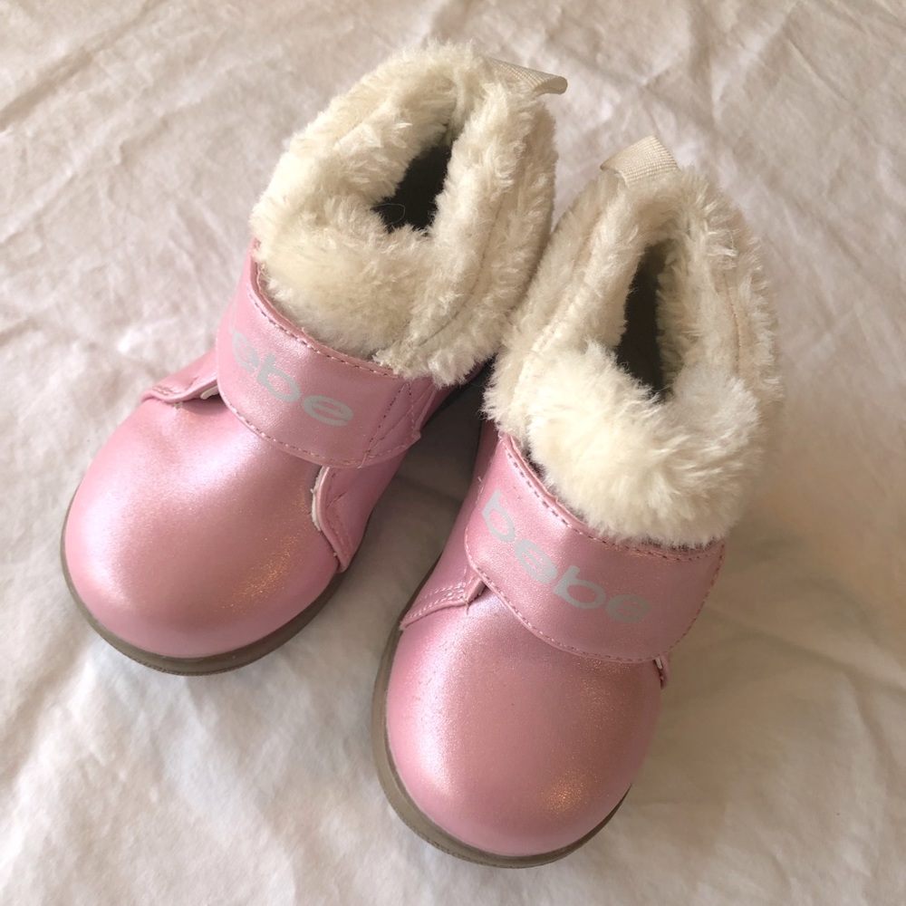 Bebe pink fuzzy boots.